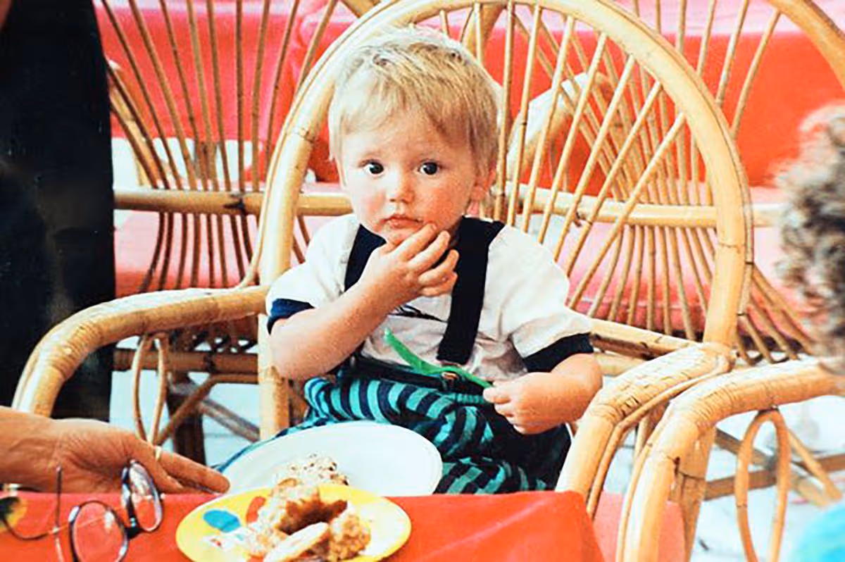 Undated handout of Ben Needham as a toddler sitting in a wicker chair with a plate of food in front of him