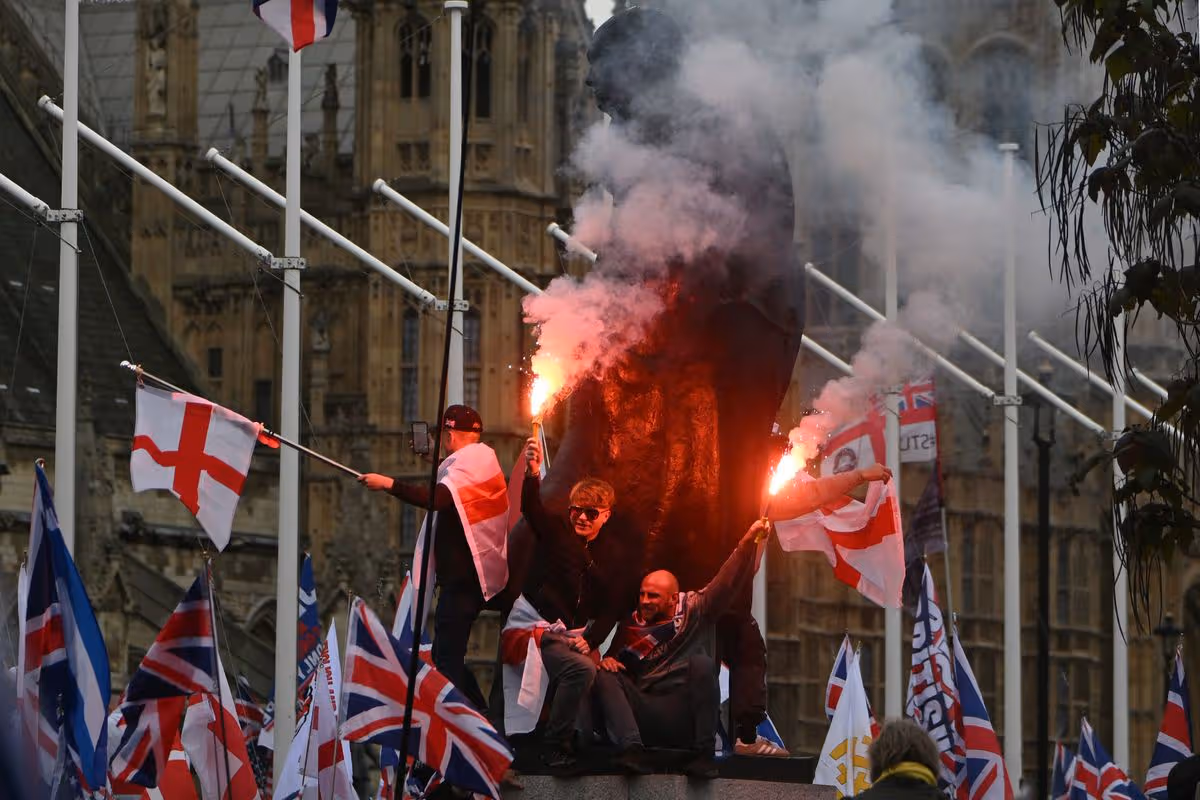 In Parliament Square, supporters of British far-right activist Tommy Robinson, real name Stephen Yaxley-Lennon, let off flares beside the statue of Winston Churchill 