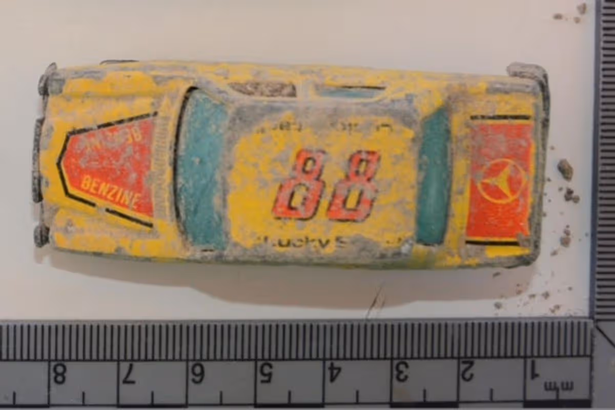 Police evidence photo of a yellow toy car found in a search for Ben Needham