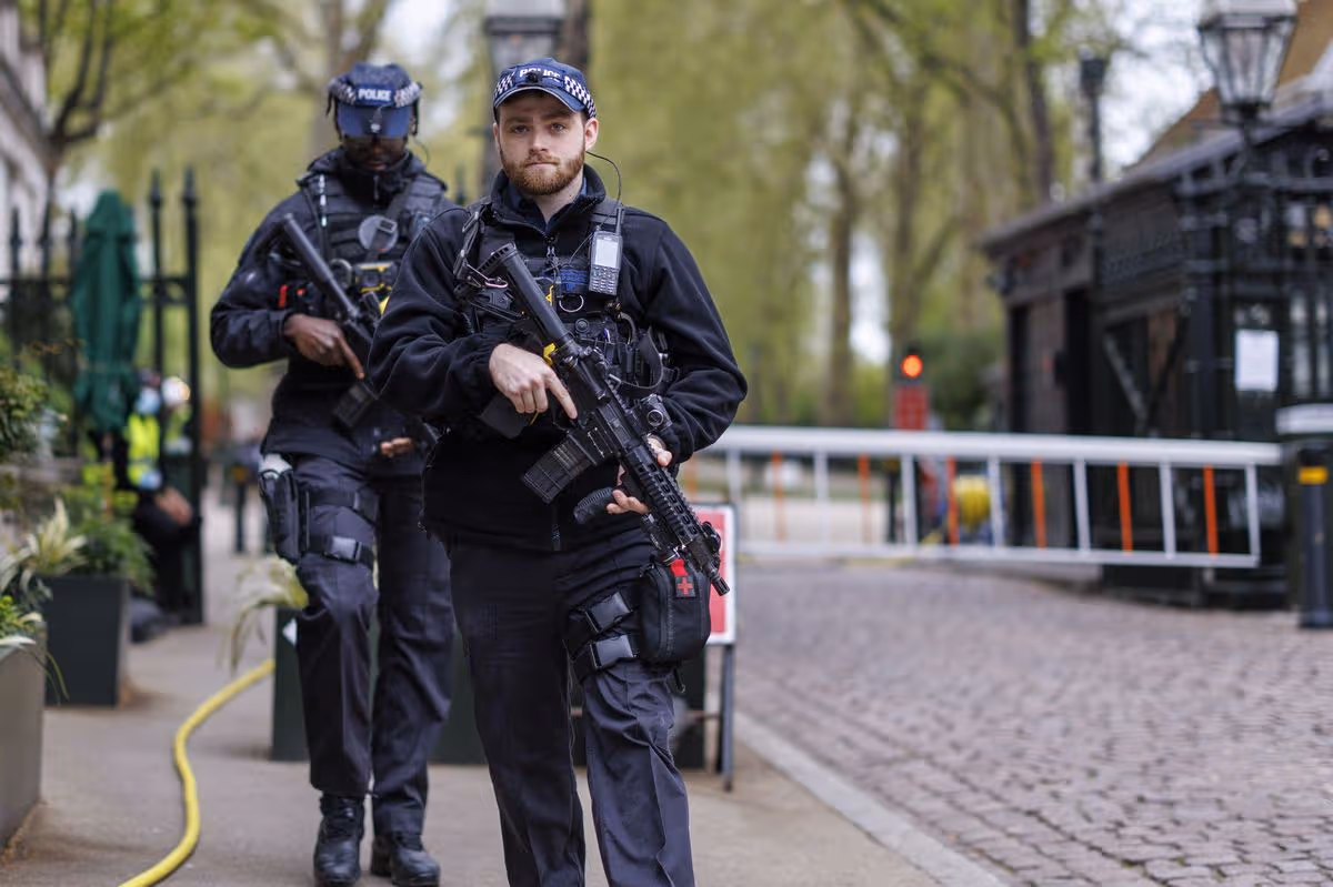 Armed police respond to an incident at the Israeli embassy