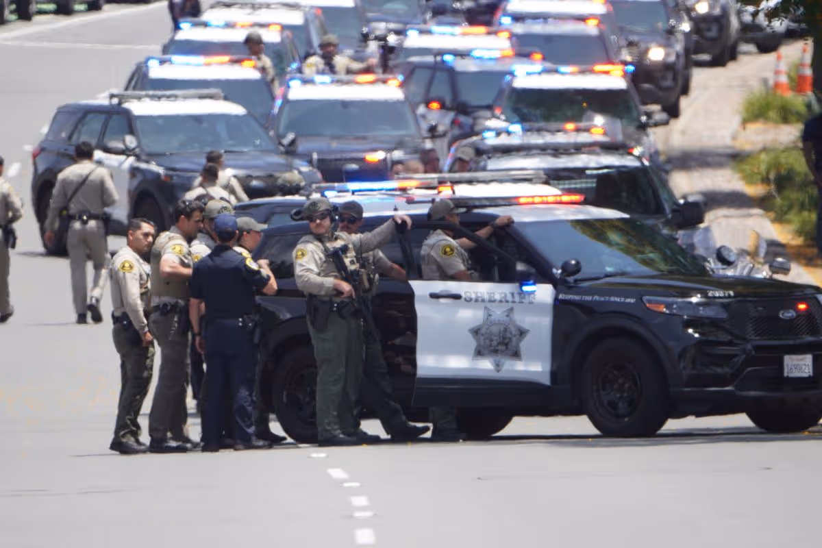 Police officers and vehicles at the scene 