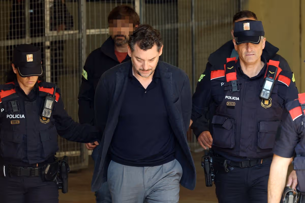 Jonathan Andic escorted by police into court