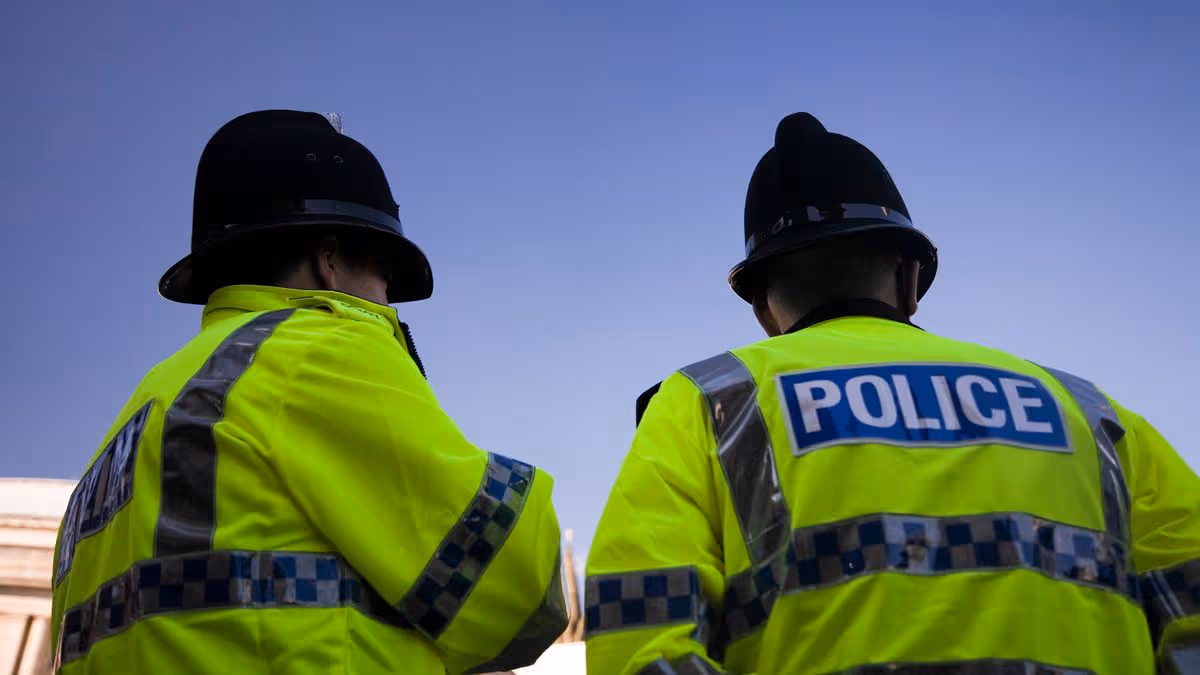 0_Two-British-Policemen-wearing-Traditional-Helmets-Click-below-for-more.jpg