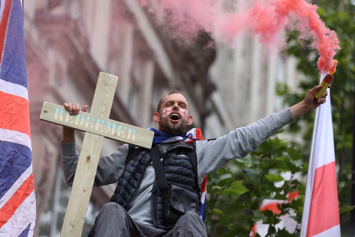 Police implemented extensive security measures along the march route, which saw protesters wave flags and religious crosses
