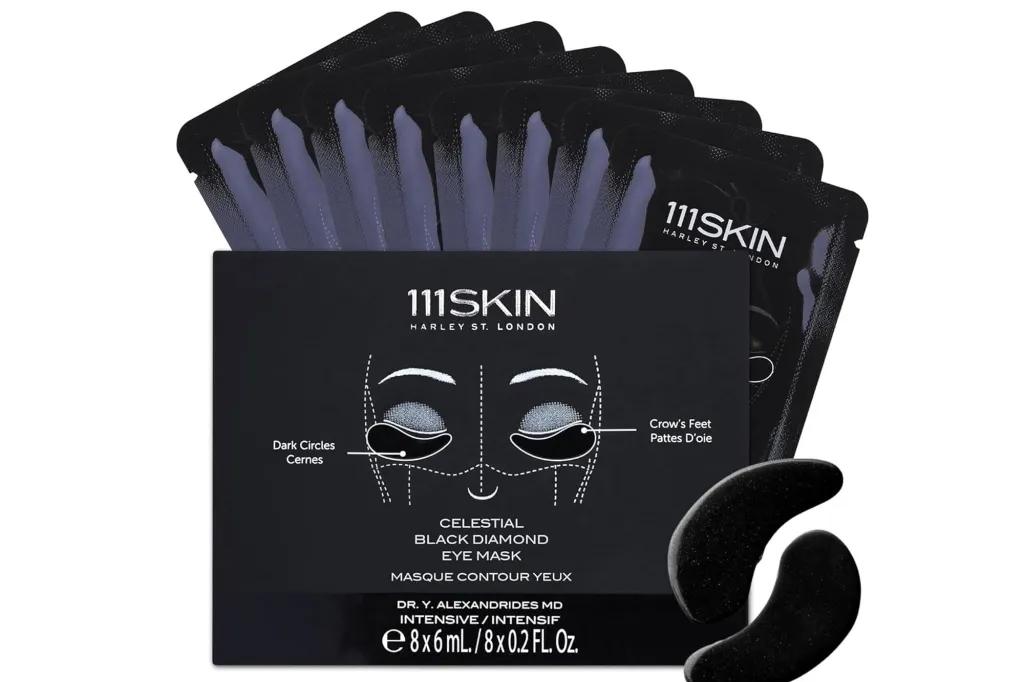 A box of 111SKIN Celestial Black Diamond Eye Masks with several individual packets of the eye masks.