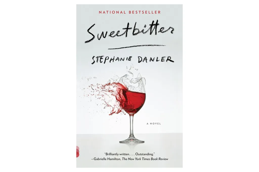 Book cover for "Sweetbitter" by Stephanie Danler, showing a wine glass shattering with red liquid splashing out.