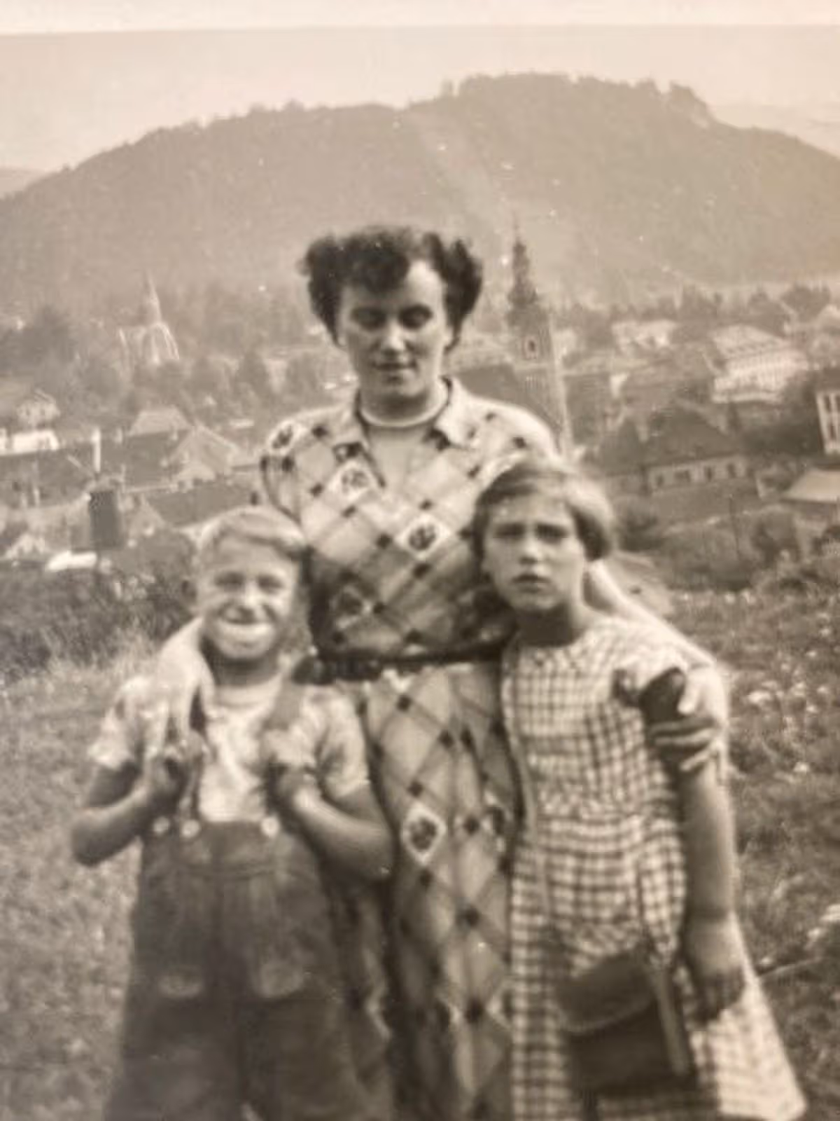 Woman with two children in black and white photo