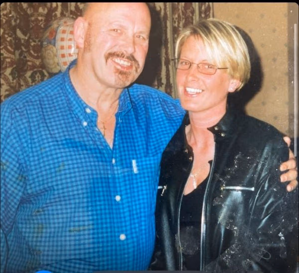 Karen as an adult, being hugged by her dad