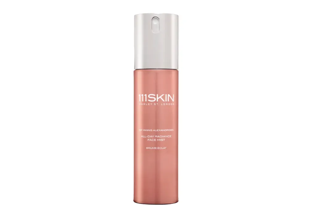 111Skin All-Day Radiance Face Mist in a peach-colored bottle.