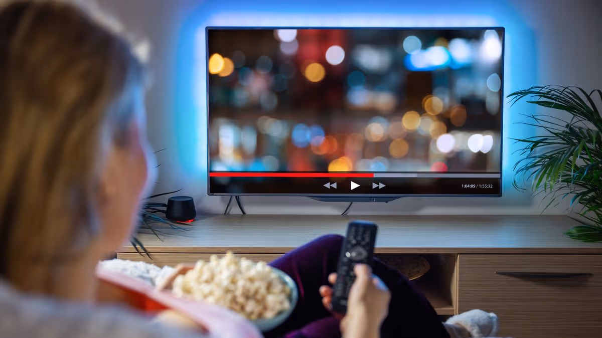 1779375426_1_Woman-relaxing-at-home-in-evening-and-watching-TV.jpg
