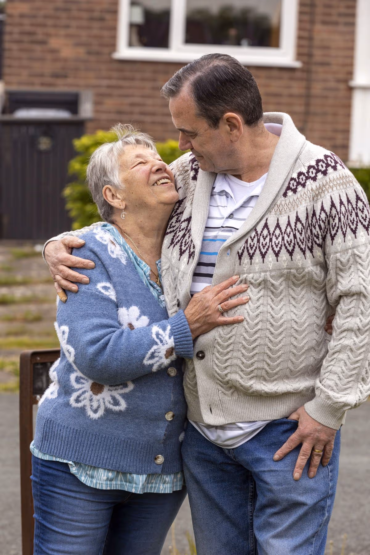Nancy hugging her husband Colin