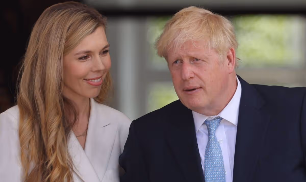 Blonde woman with fair-haired man wearing a suit. 