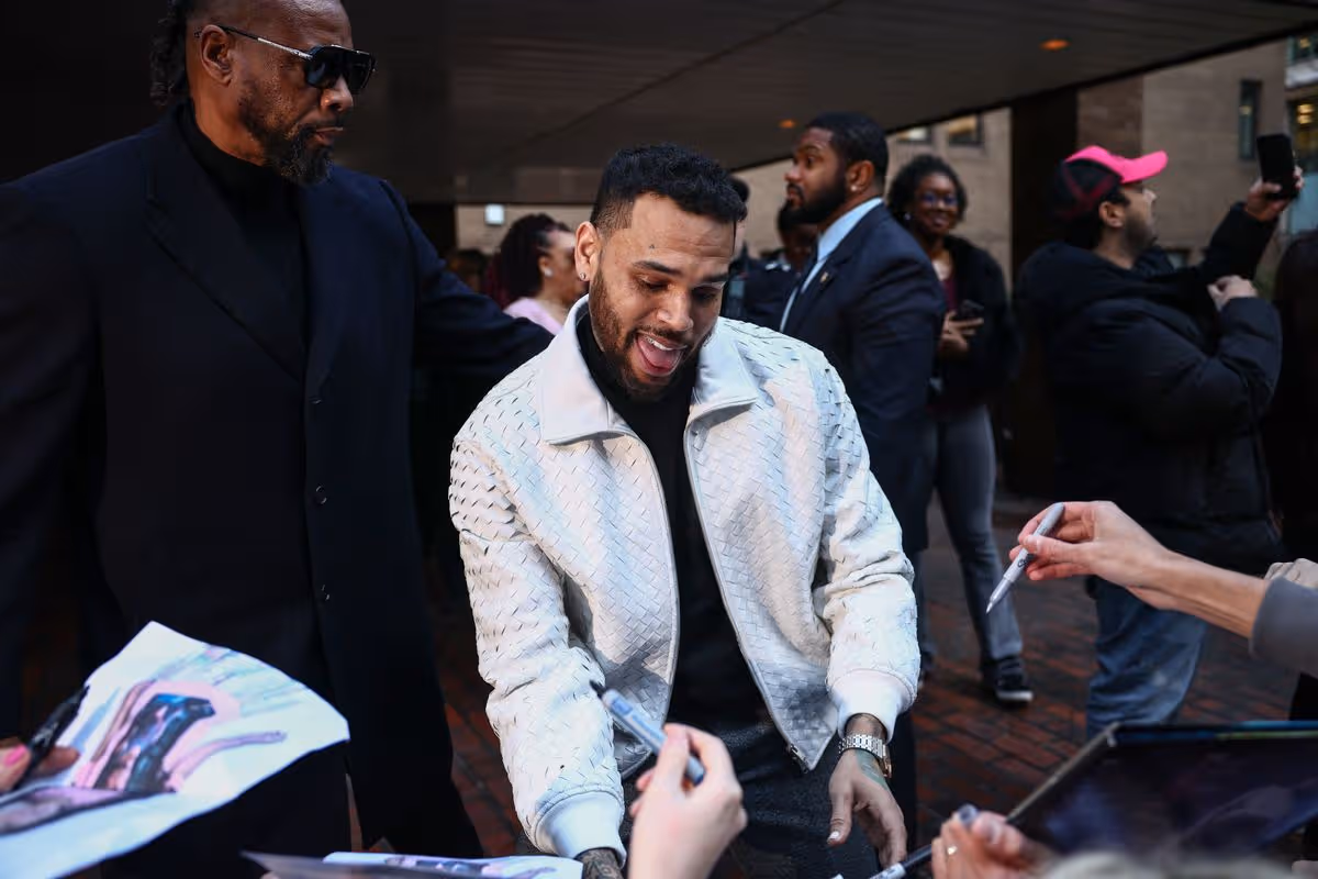 R&B singer Chris Brown signs autographs