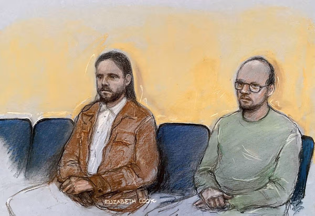 Court artist drawing by Elizabeth Cook of Jamie Varley, 36 (left) sits in the dock at Preston Crown Court where he is accused of the murder and sexual assault of 13-month-old Preston Davey in 2023, whilst in he was in the process of adopting the child along with co-accused John McGowan-Fazakerley, 31, (right). Picture date: Monday April 20, 2026.