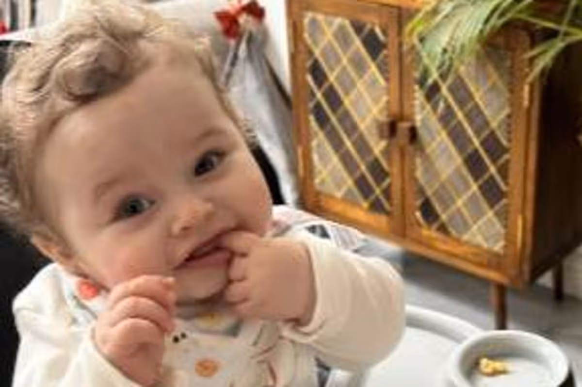 Baby Preston Davey the morning after his first sleepover with his adoptive parents Jamie Varley and John McGowan-Fazackerley