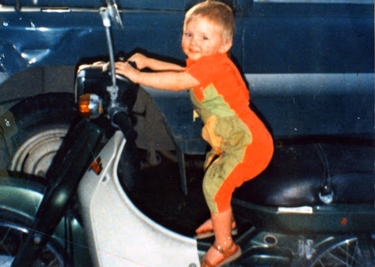 Ben Needham on a moped posing