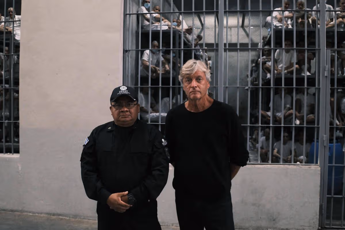 Richard Madeley and a prison officer in front of a prison