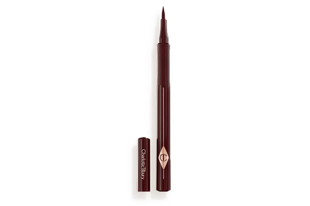 Charlotte Tilbury brown liquid eyeliner with the cap next to it.