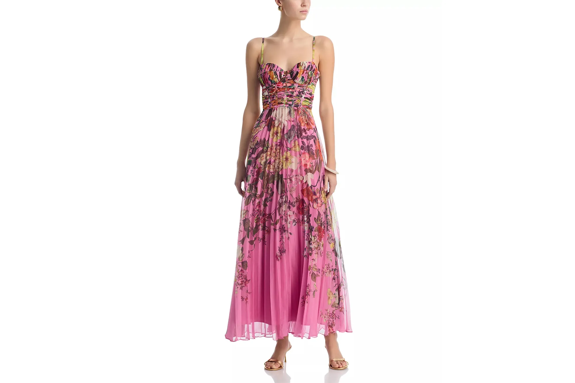 Model wearing a pink floral pleated maxi dress with spaghetti straps.