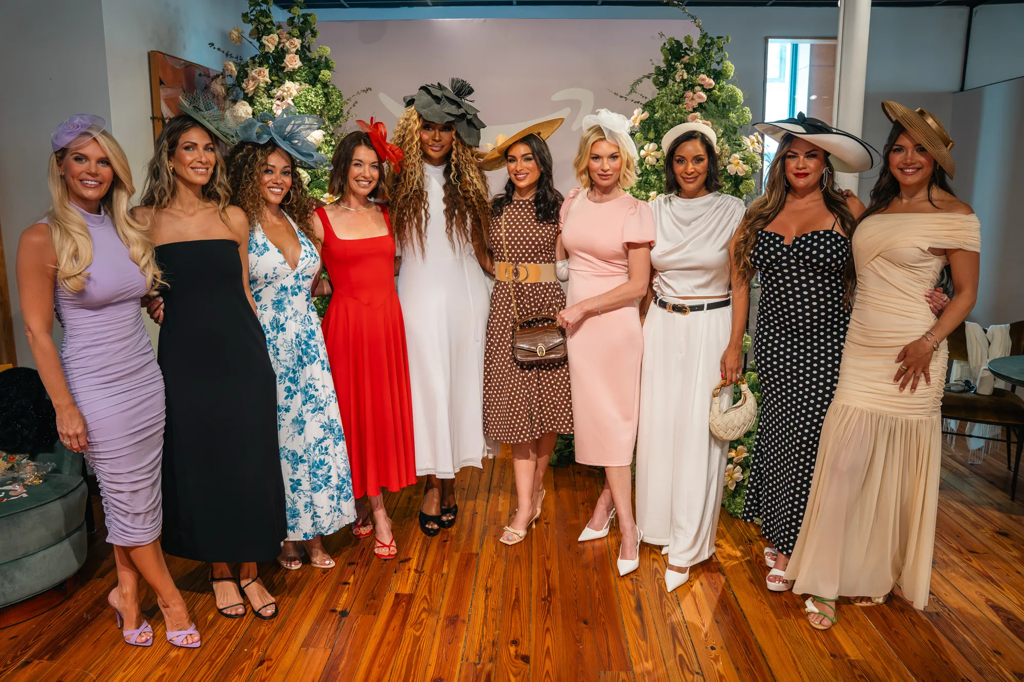 Nine reality TV moms dressed in dresses and hats for a Kentucky Derby trip.