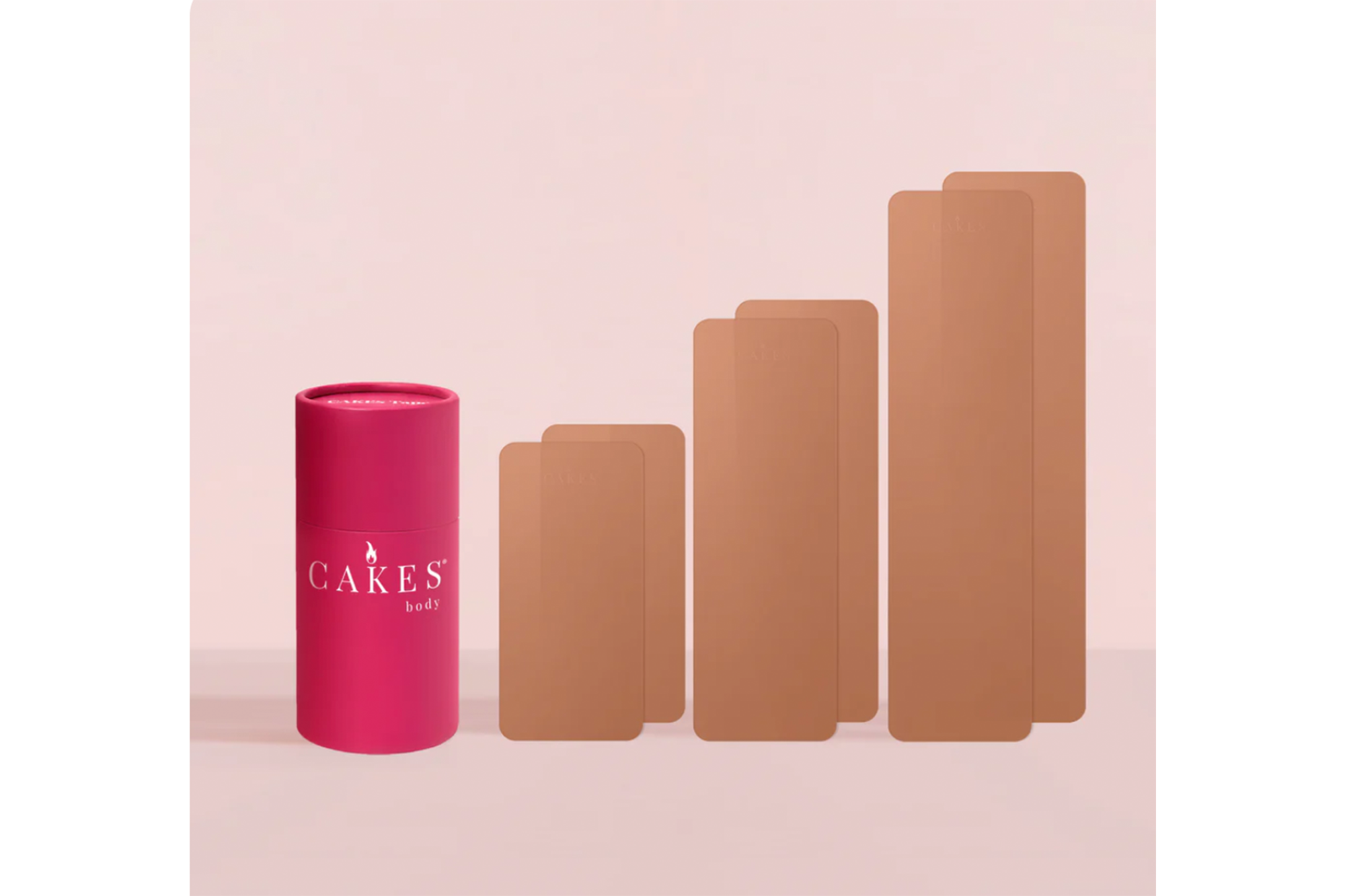 Pink tube of "Cakes Body" pasties next to six brown pasties.