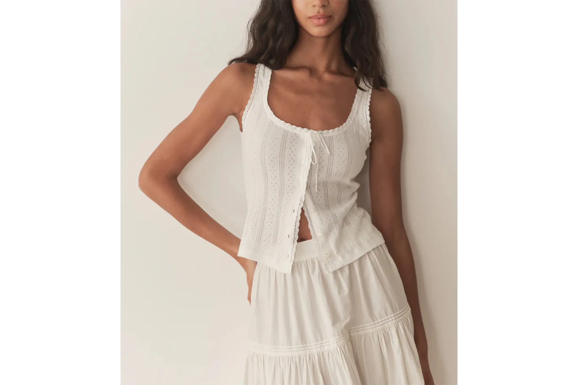 Model wearing white Lois Tank and skirt.