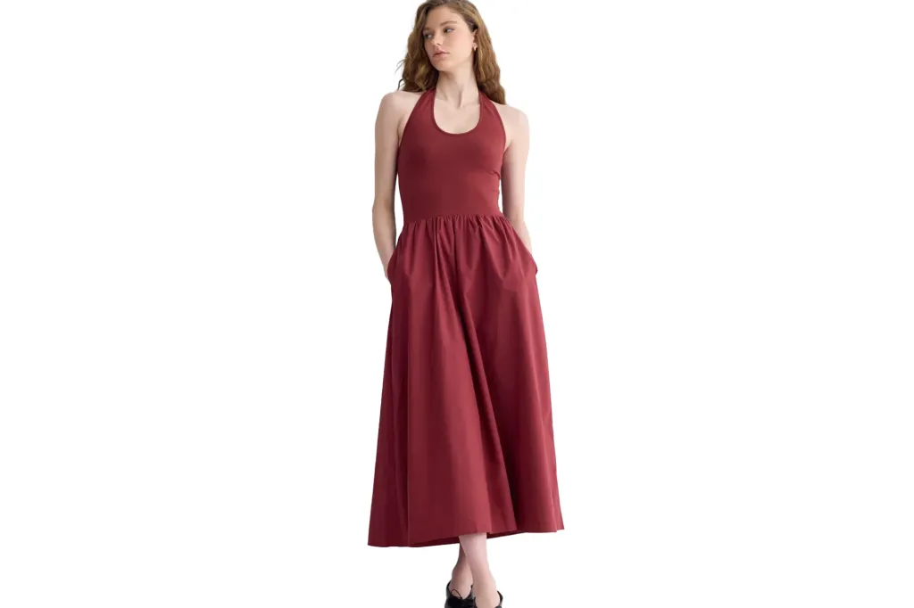 Red halter neck dress with a full skirt and pockets.