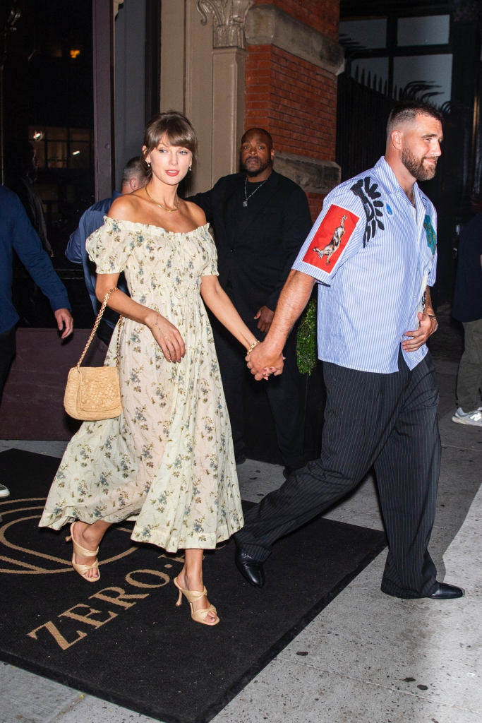 Taylor Swift and Travis Kelce holding hands while leaving Zero Bond in NYC.