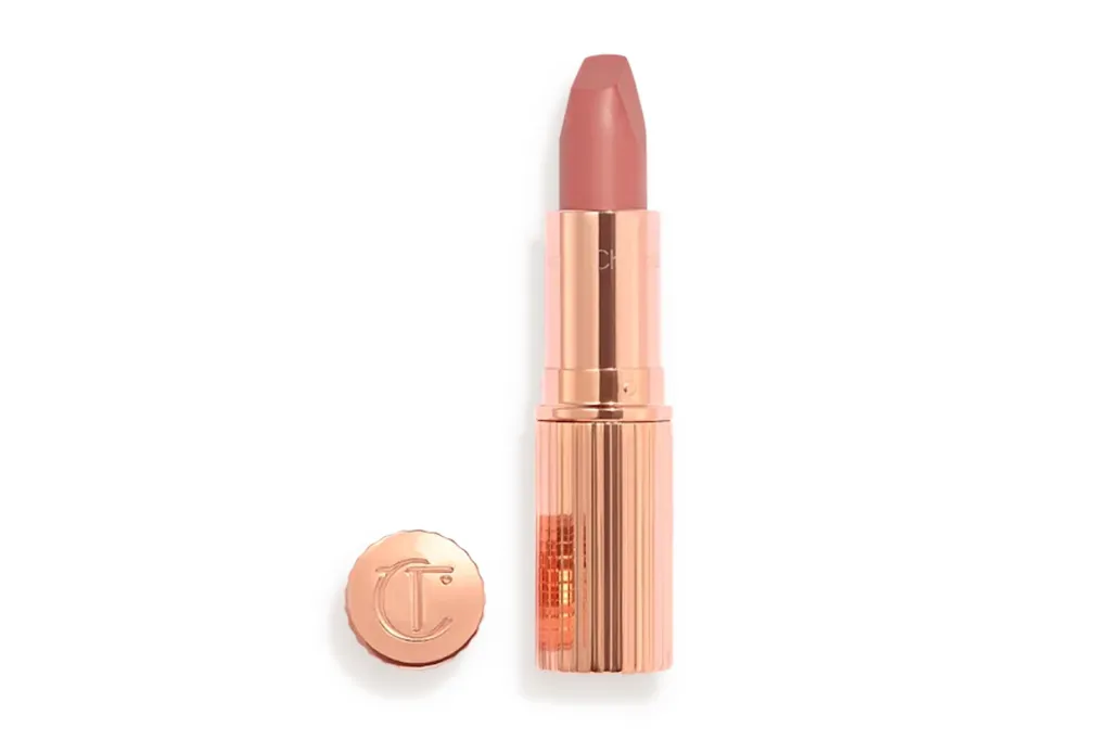 Pillow Talk lipstick by Charlotte Tilbury in a rose gold tube with the cap removed.