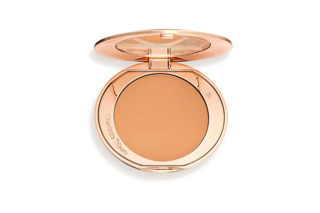 Charlotte Tilbury powder compact in a rose gold case.