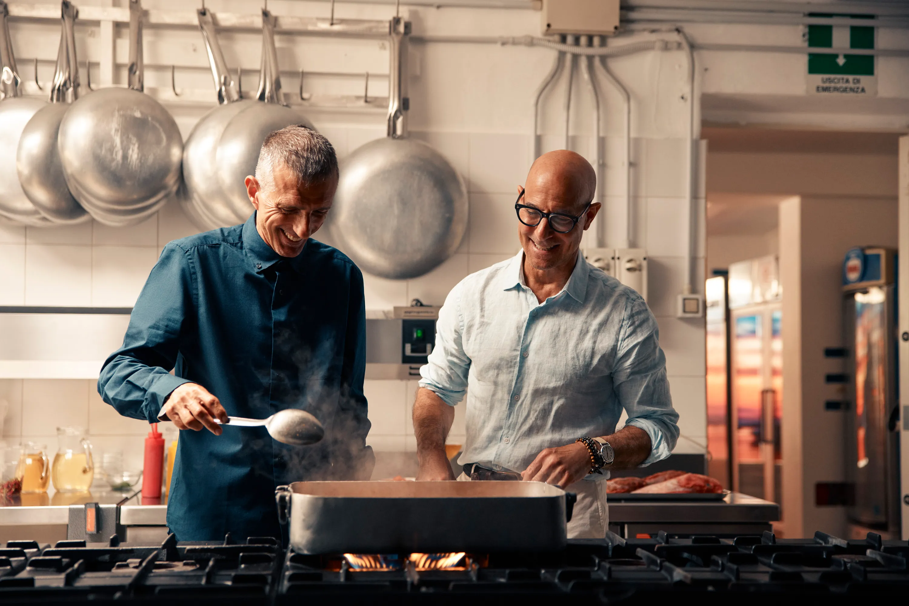 TUCCI IN ITALY - âSardiniaâ - Stanley Tucci in the kitchen of Da Tonino with Giuseppe Bertoleoni, the heir to the throne of Tavolara. He also runs the kitchen. (National Geographic/Matt Holyoak)
GIUSEPPE BERTOLEONI, STANLEY TUCCI
GIUSEPPE BERTOLEONI, STANLEY TUCCI