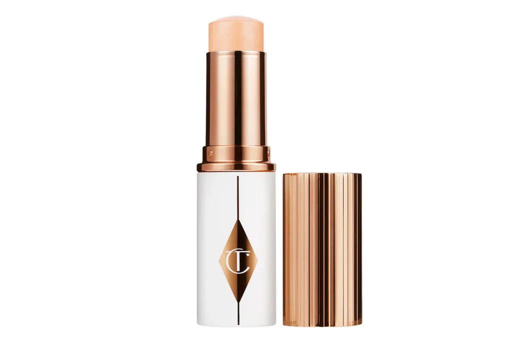 Charlotte Tilbury Hollywood Glow Glide Face Architect Highlighter in a white and rose gold tube.