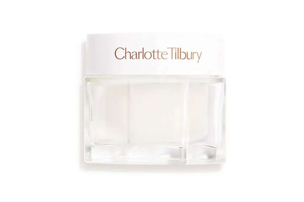 Charlotte Tilbury Magic Cream in a white and clear glass jar.