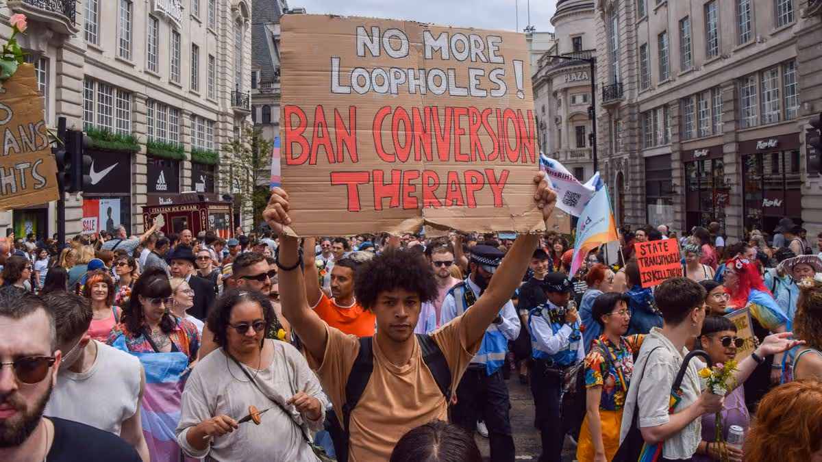 0_A-protester-holds-a-placard-calling-for-a-ban-on-conversion.jpg
