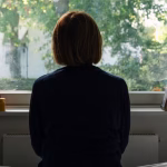 1_Rear-view-of-a-depressed-woman-looking-out-of-her-bedroom-window-on-a-sunny-day-negative-emotion.j.avif