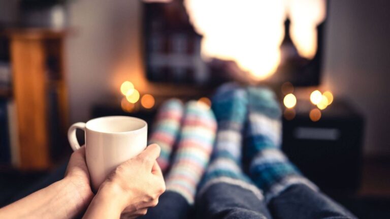 0_Couple-drinking-tea-hot-chocolate-eggnog-or-mulled-wine-and-watching-tv-in-warm-cozy-woolen-socks.jpeg