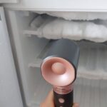 1774656735_0_person-defrosting-freezer-with-hair-dryer.jpg