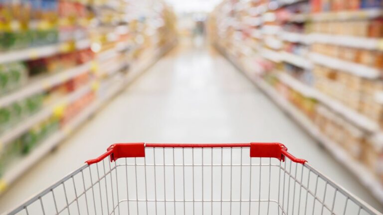 1774660446_0_Shopping-cart-view-in-Supermarket-aisle-with-product-shelves-abstract-blur-defocused-background.jp_.jpeg