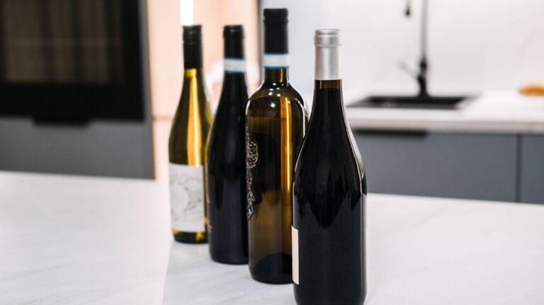 1774671605_0_A-selection-of-wine-bottles-displayed-on-a-sleek-kitchen-counter-showcasing-different-varieties-fo.jpeg
