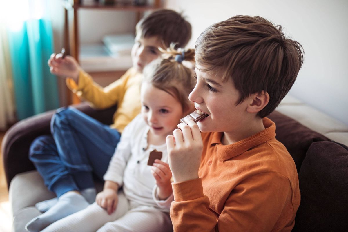 Children eat chocolate