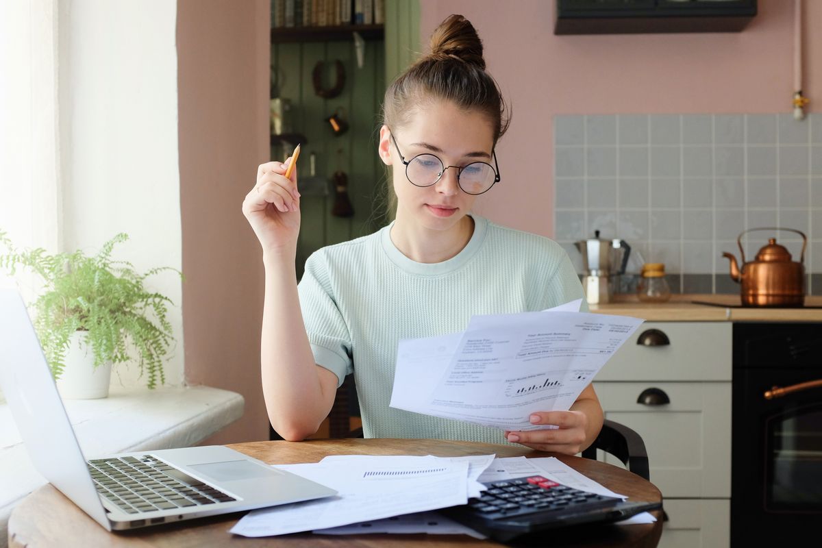 Young girl sorting finances