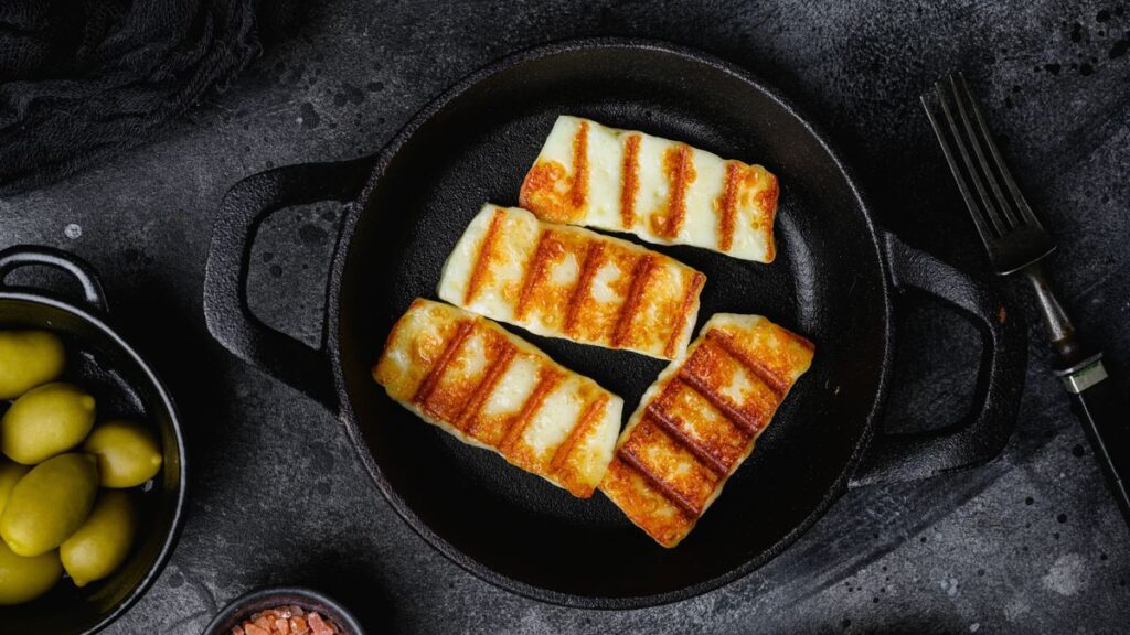 1775138910_1_Halloumi-fried-cheese-on-black-dark-stone-table-background-top-view-flat-lay.jpg