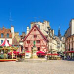 1775352424_0_Dijon-city-historical-centre-with-old-typical-houses-colorful-buildings-and-merry-go-round-carouse.jpeg
