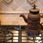 1776306505_0_Tea-Pot-Cooking-with-Natural-Gas-on-Cook-Top-Stove.jpg