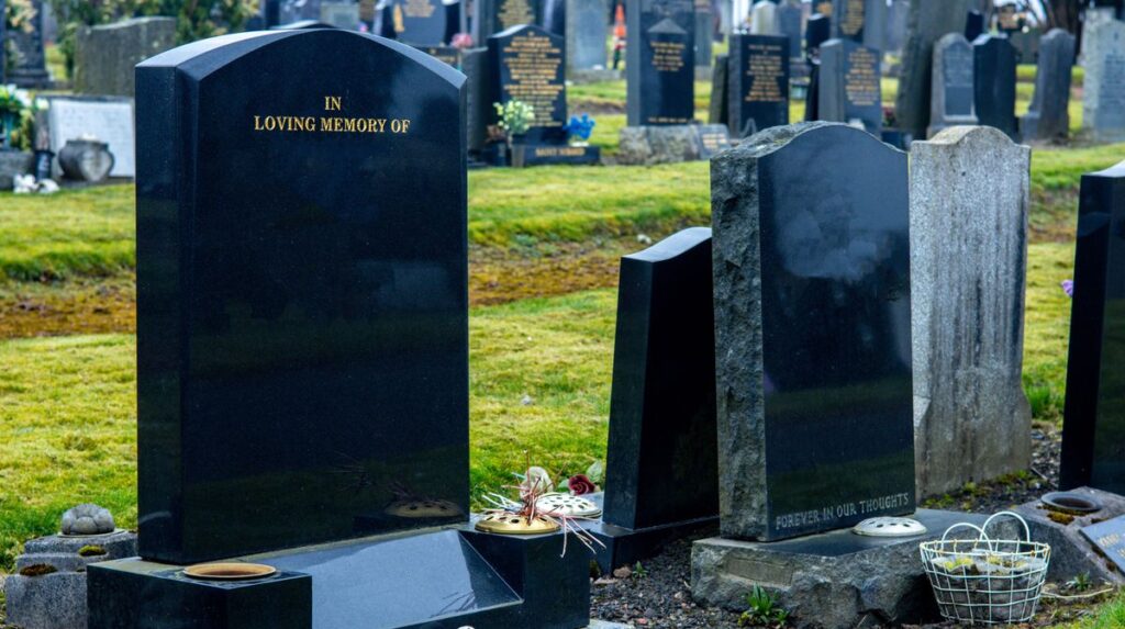 1776892031_0_Blank-Black-Gravestones-Within-A-Typical-Cemetery-Where-People-Are-Laid-To-Rest.jpg