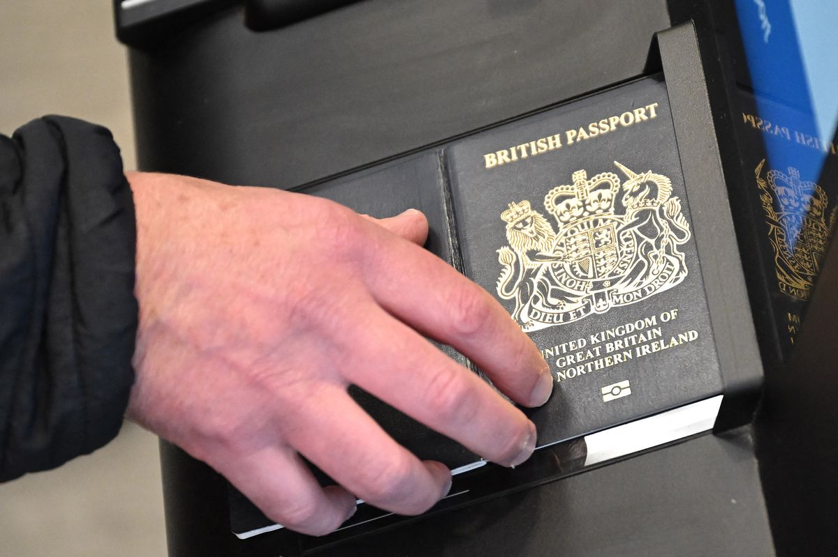 A person as their passport scanned whilst using an Automated European Union Entry/Exit System (EES) kiosk during a press preview on the rollout of the EU's new Entry-Exit System (EES) at Eurotunnel, south east England on September 23, 2025. The European Union's new border-check system for non-EU nationals, the so-called Entry/Exit System (EES), which will do away with passport stamps, is set to finally launch October 12. (Photo by Justin TALLIS / AFP) (Photo by JUSTIN TALLIS/AFP via Getty Images)          
